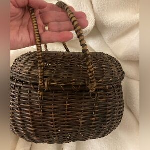 Antique basket with attached lid
